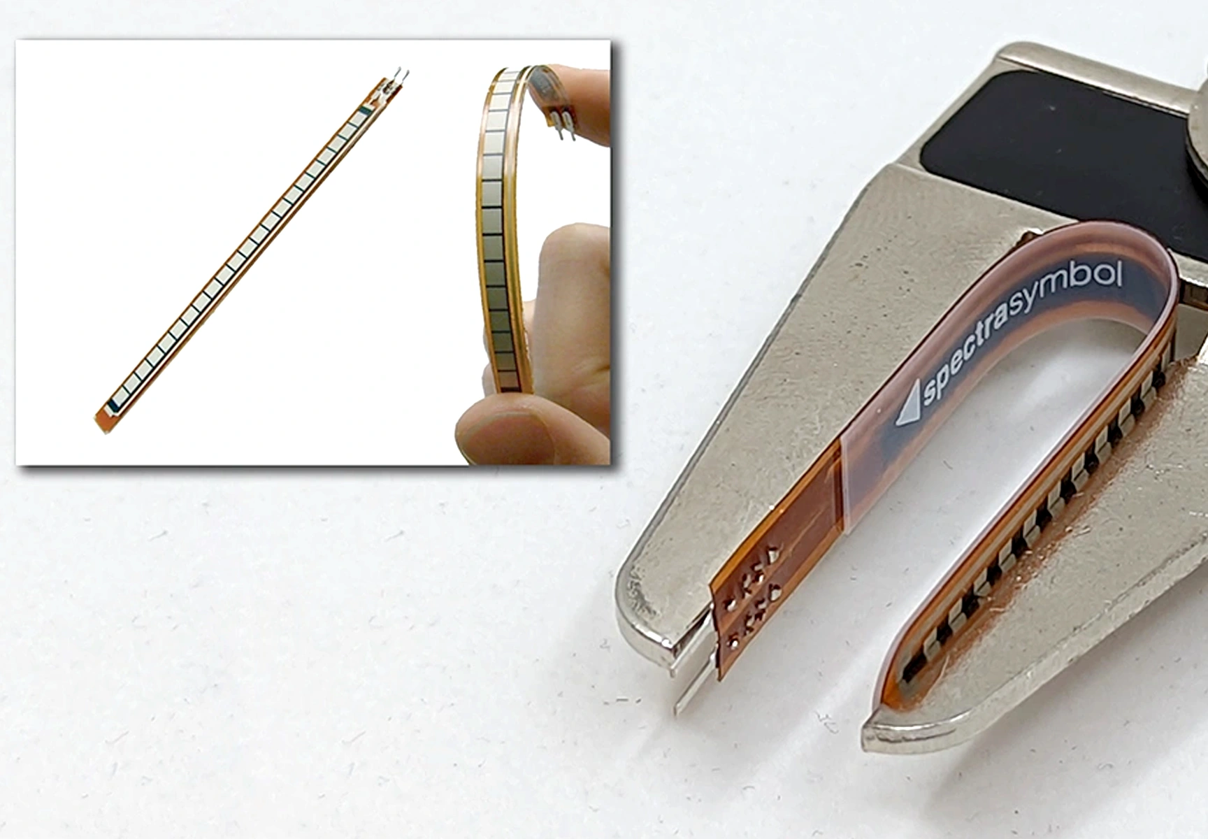 Photo showing a tight bend of Spectra Symbol's Flex Sensor in calipers & a broad bend in human hand